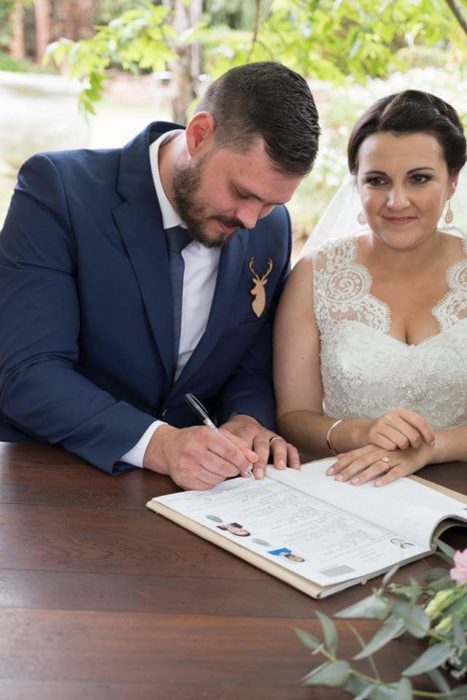 Couple Signing Wedding Documents